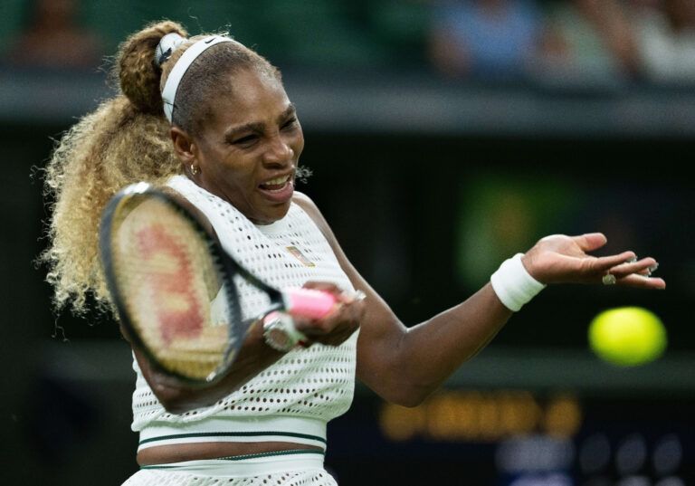 Serena Williams of the United States returns a shot during her match against Maya Joint of Australia on day two at All England Lawn Tennis and Croquet Club.