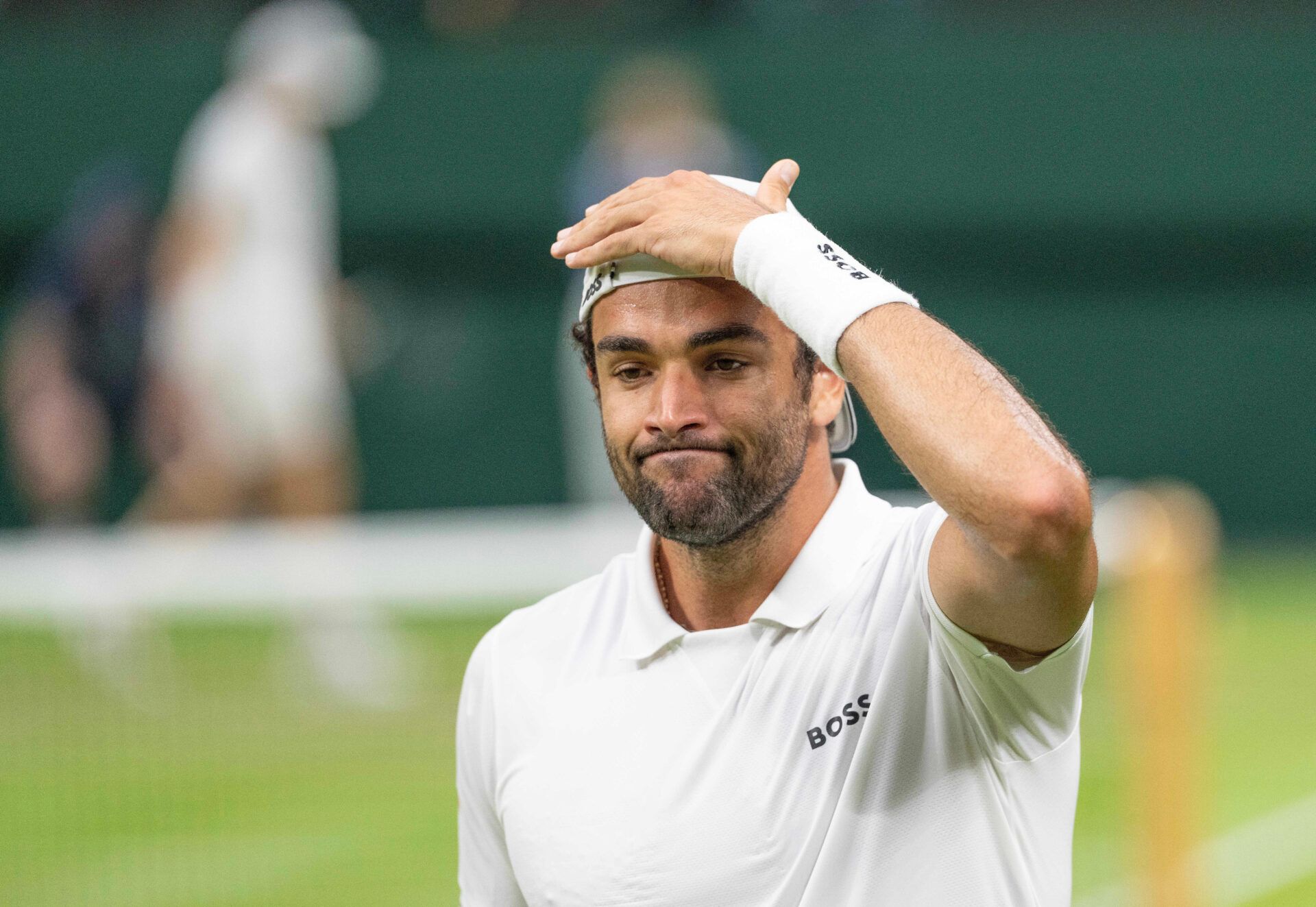 Matteo Berrettini of Italy reacts to a point during his match against Jannik Sinner of Italy (not shown) on day three of The Championships at All England Lawn Tennis and Croquet Club.