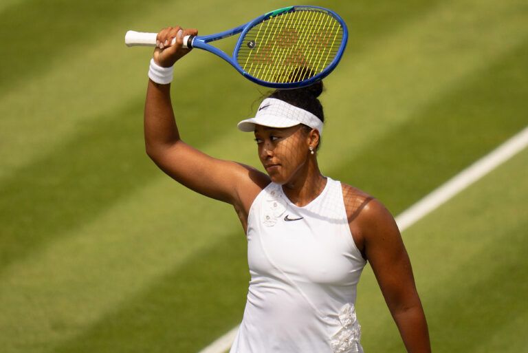 Naomi Osaka of Japan celebrates winning her match against Anastasia Gasanova on day three at All England Lawn Tennis and Croquet Club.