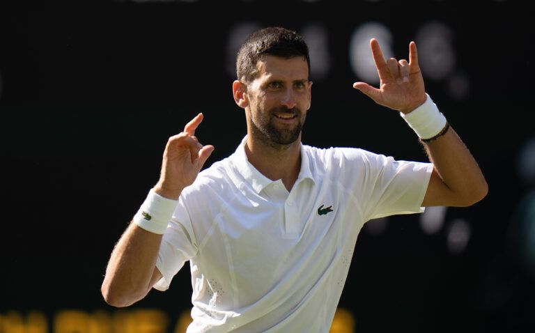 Novak Djokovic of Serbia celebrates winning his match against Arthur Rinderknech of France on day five at All England Lawn Tennis and Croquet Club.