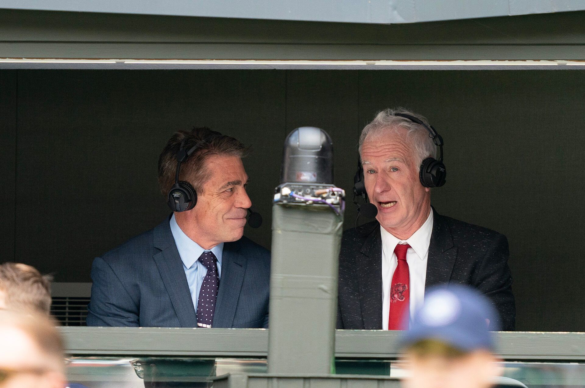 John McEnroe and Chris Fowler in the ESPN booth on Centre Court during the Novak Djokovic (SRB) and Pedro Cachin (ARG) match at the All England Lawn Tennis and Croquet Club.