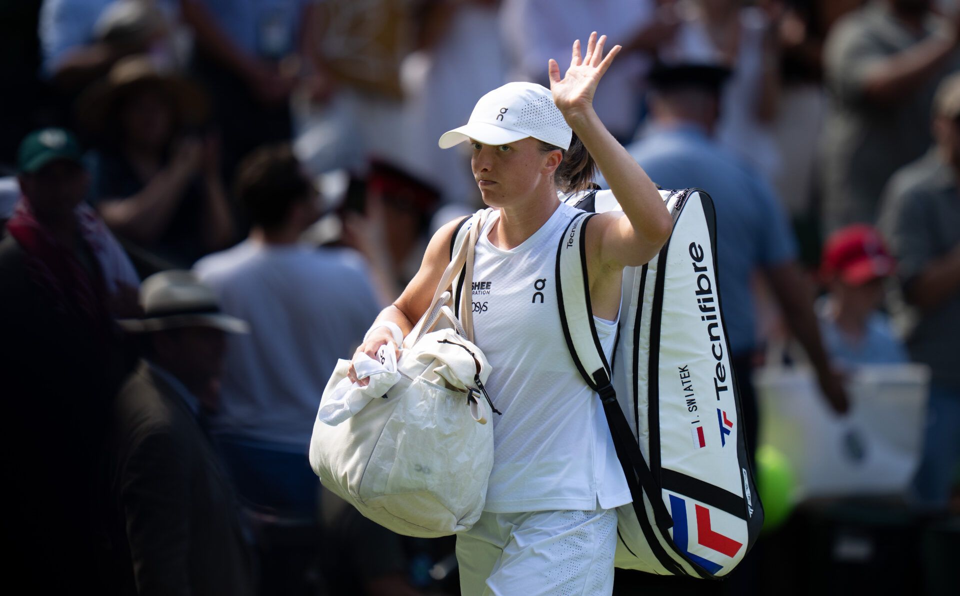 Alexandra Eala of the Philippinesr celebrates winning her match against Iga Swiatek of Poland on day six at All England Lawn Tennis and Croquet Club.