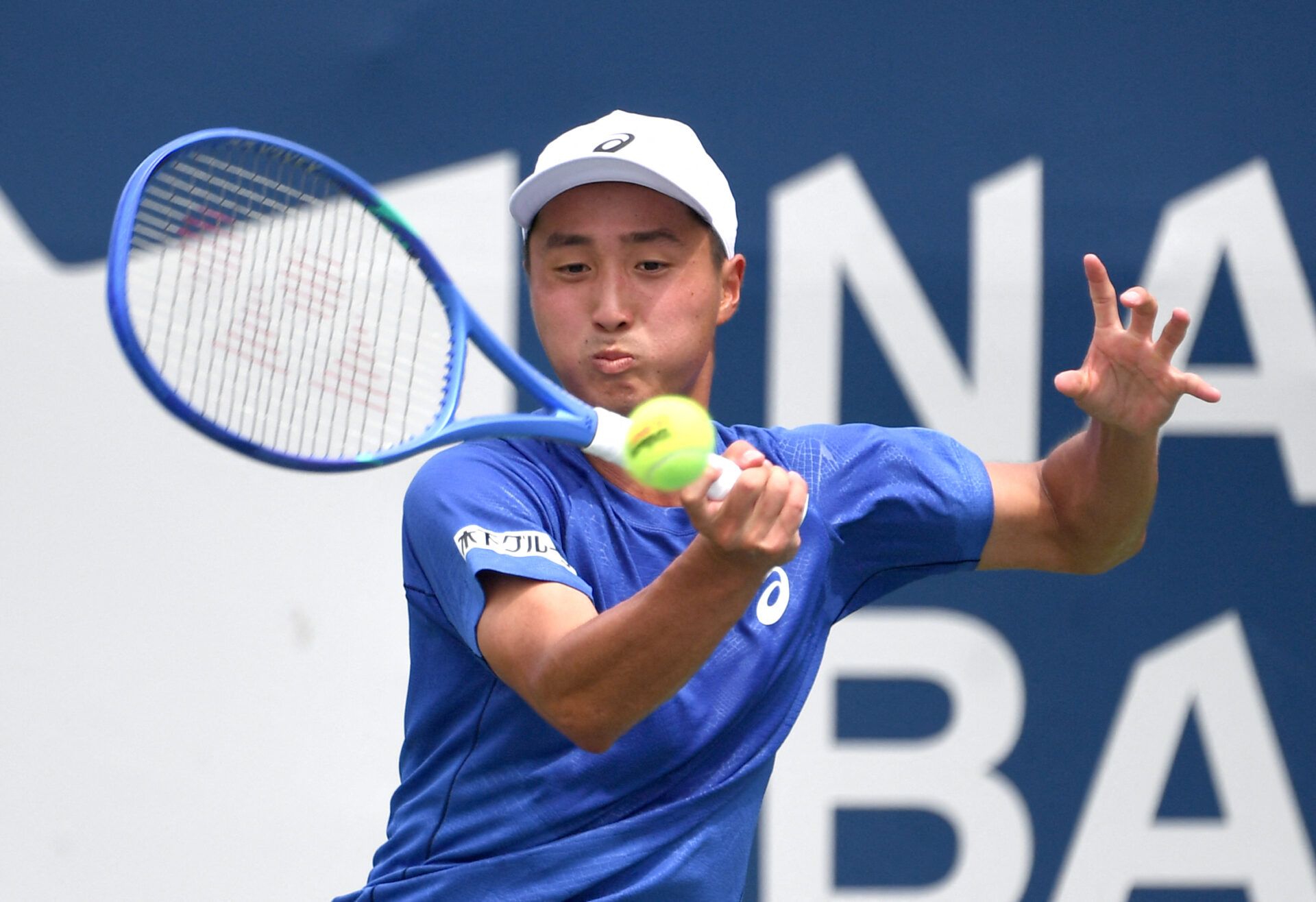 Shintaro Mochizuki (JPN) plays a shot against Yasutaka Uchiyama (JPN) during qualifying play at Sobeys Stadium.