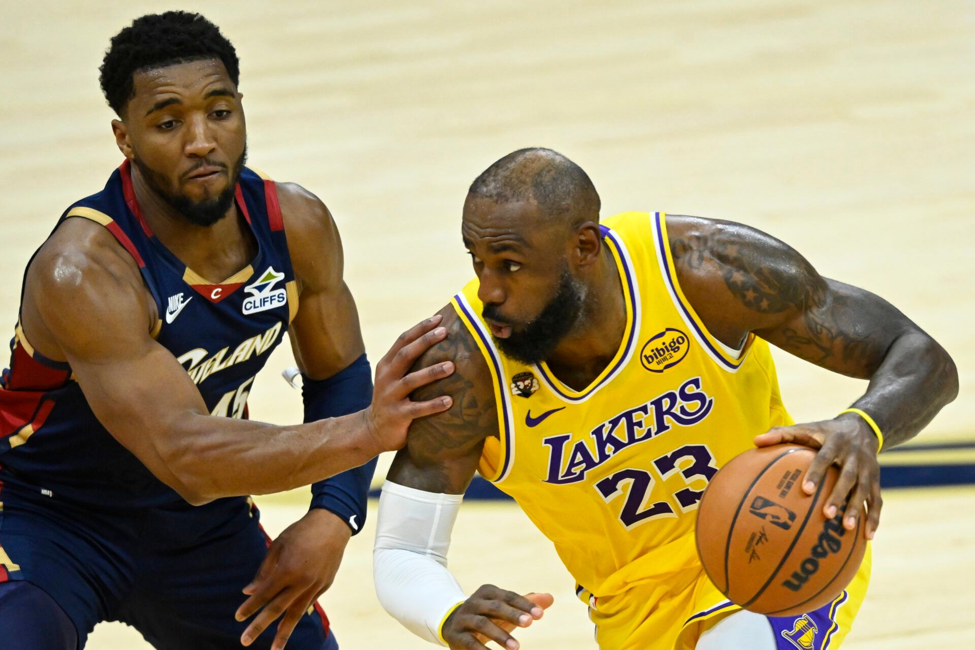 Cleveland Cavaliers guard Donovan Mitchell (45) defends Los Angeles Lakers forward LeBron James (23) in the fourth quarter at Rocket Arena.