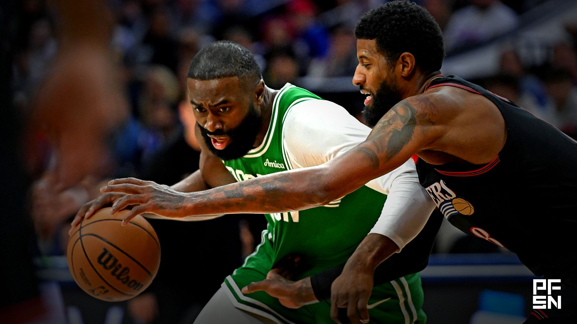 Boston Celtics guard Jaylen Brown (7) drives to the basket against Philadelphia 76ers forward Paul George (8) during the first half at Xfinity Mobile Arena.