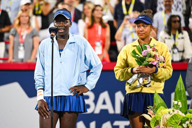 Victoria Mboko (CAN) tournament winner addresses the crowd beside runner up Naomi Osaka (JPN) at IGA Stadium.
