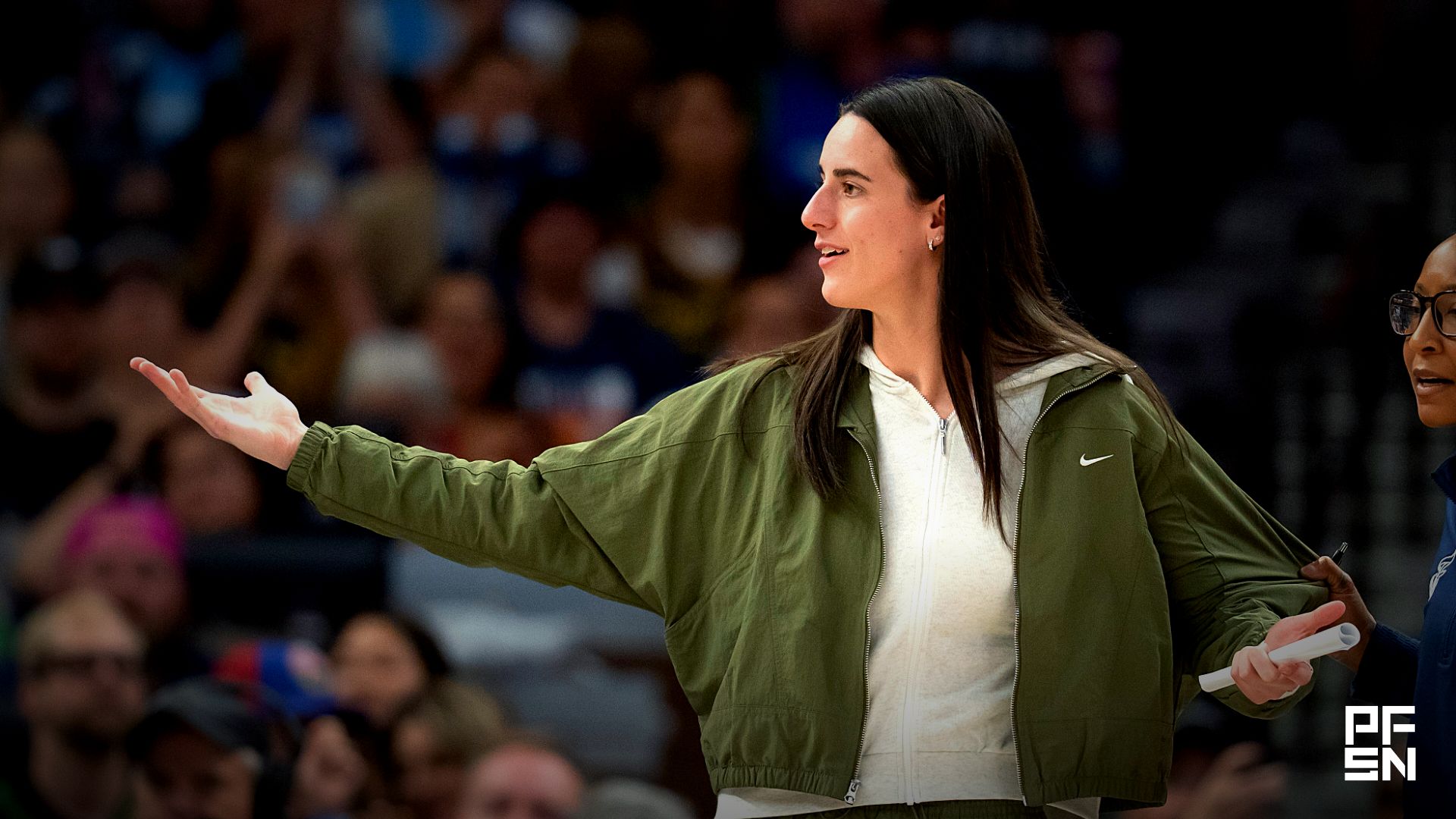 Indiana Fever guard Caitlin Clark (22) reacts from the bench to a foul called against the Minnesota Lynx in the first half at Target Center.