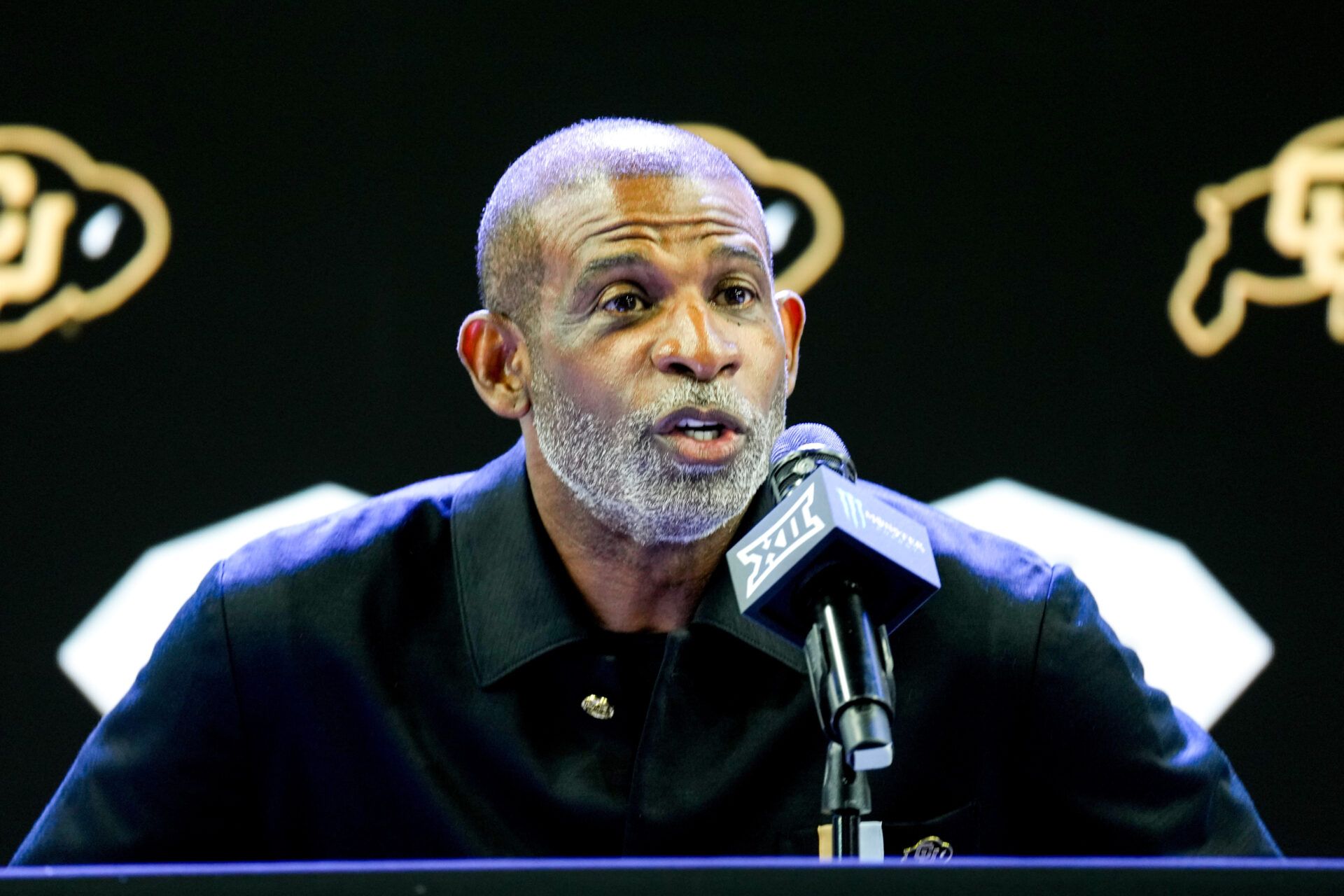 Colorado head coach Deion Sanders speaks to reporters during Big 12 Conference Football Media Days at The Star.