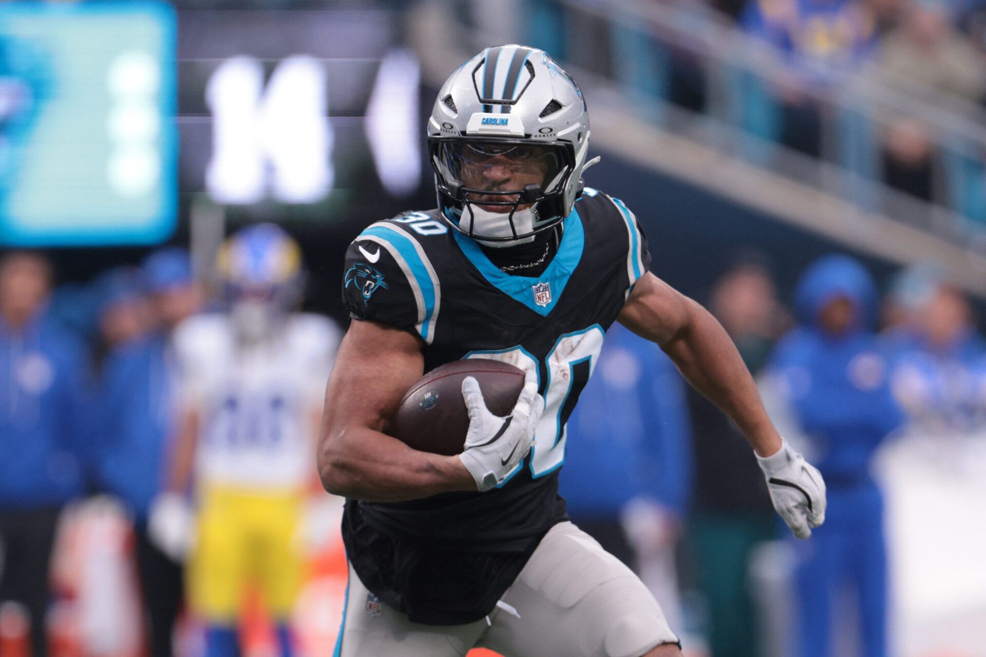 Carolina Panthers running back Chuba Hubbard (30) rushes during the second quarter against the Los Angeles Rams at Bank of America Stadium.