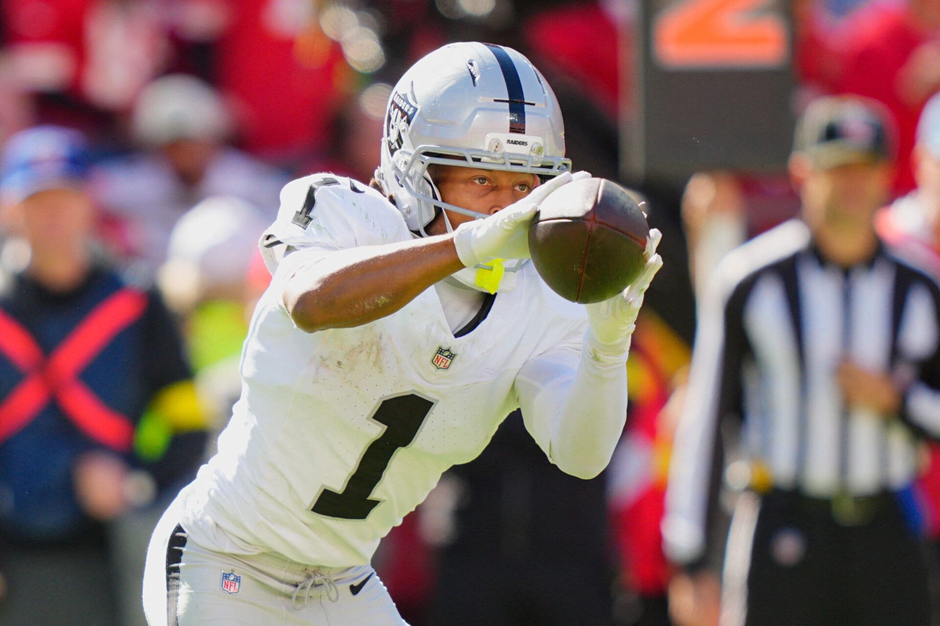 Las Vegas Raiders wide receiver Tre Tucker (1) makes a reception against the Kansas City Chiefs during the third quarter of the game at GEHA Field at Arrowhead Stadium.