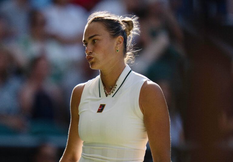 Aryna Sabalenka reacts during her match against Jelena Ostapenko of Latvia on day five at All England Lawn Tennis and Croquet Club.