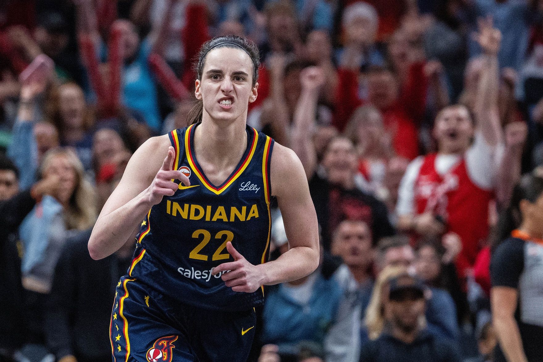 Indiana Fever guard Caitlin Clark (22) celebrates a made shot  in the first half against the Phoenix Mercury at Gainbridge Fieldhouse.