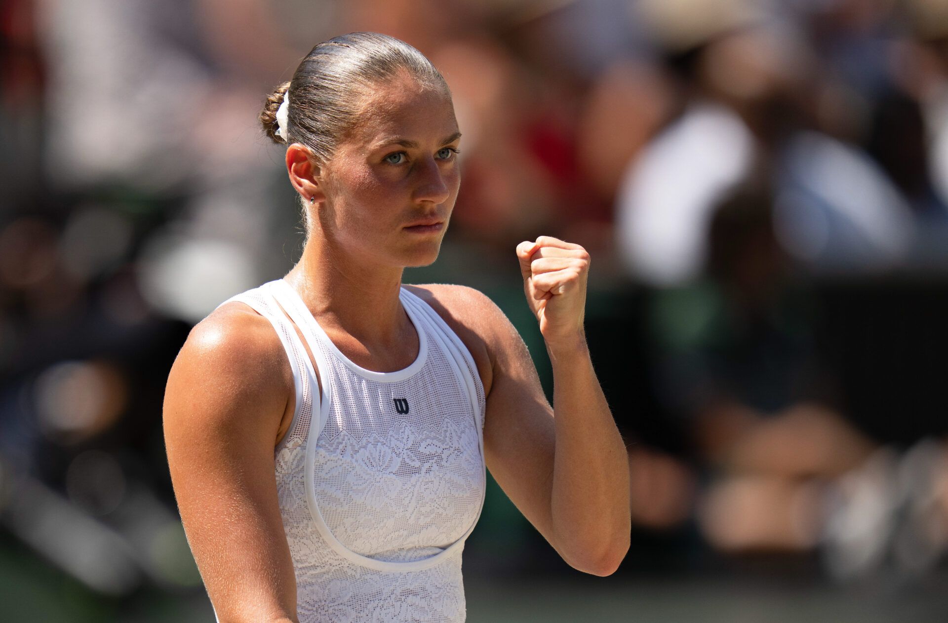 Marta Kostyuk of Ukraine reacts during her match against Jasmine Paolini of Italy on day 10 at All England Lawn Tennis and Croquet Club.