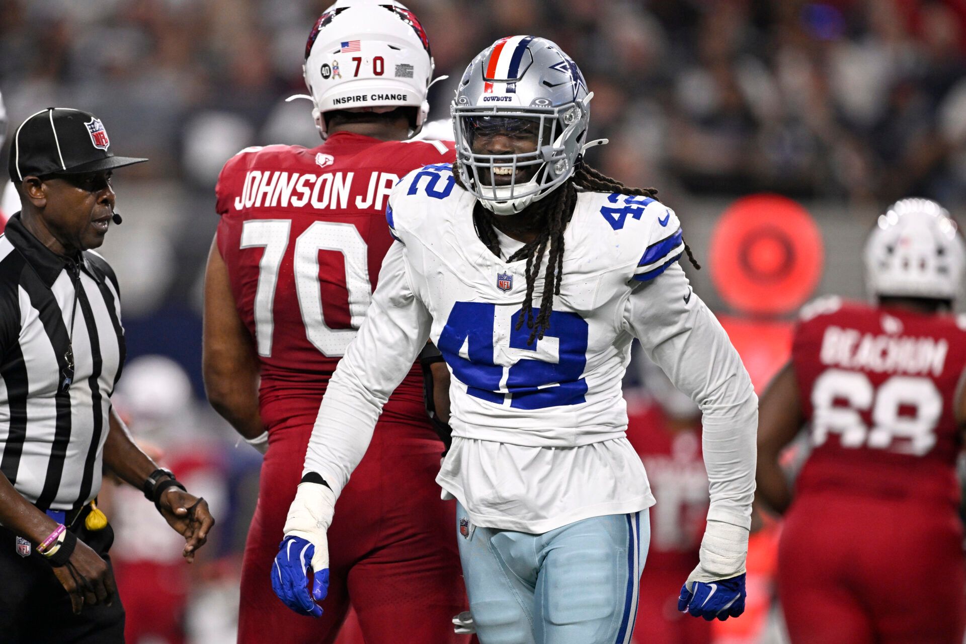 Dallas Cowboys defensive end Jadeveon Clowney (42) reacts after a sack against Arizona Cardinals quarterback Jacoby Brissett (7) in the first half at AT&T Stadium.