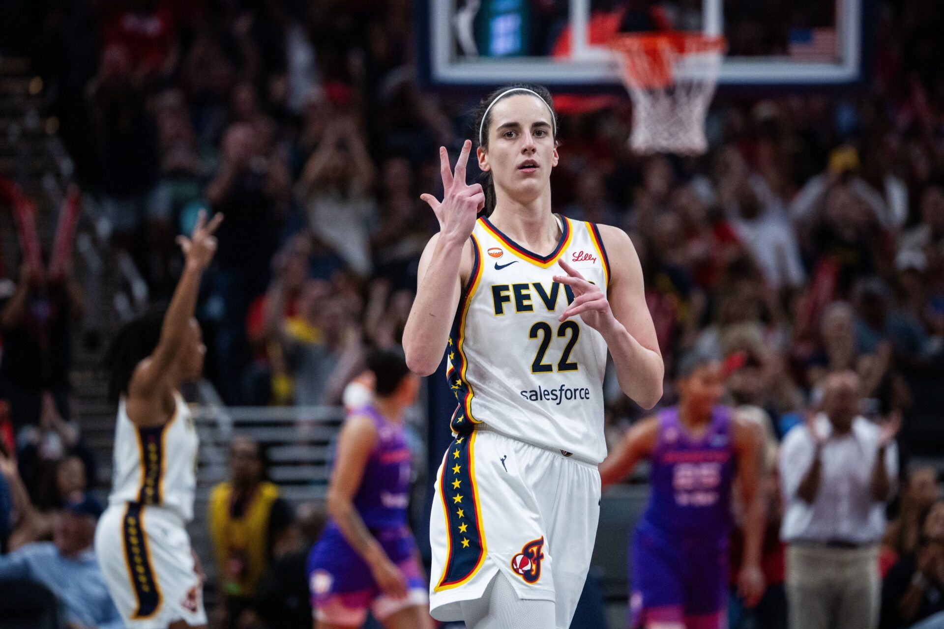 Indiana Fever guard Caitlin Clark (22) celebrates a made shot in the first half against the Phoenix Mercury at Gainbridge Fieldhouse.