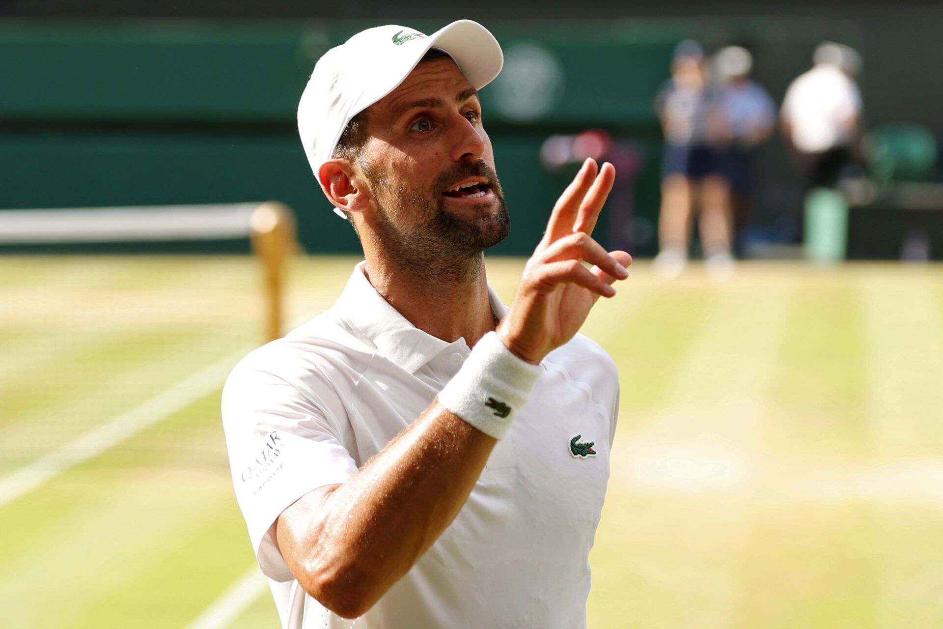 Novak Djokovic (SRB) talks two his player's box between points against Jannik Sinner (ITA) (not pictured) in a gentlemen's singles semi-final of The Championships Wimbledon 2026 at All England Lawn Tennis and Croquet Club.