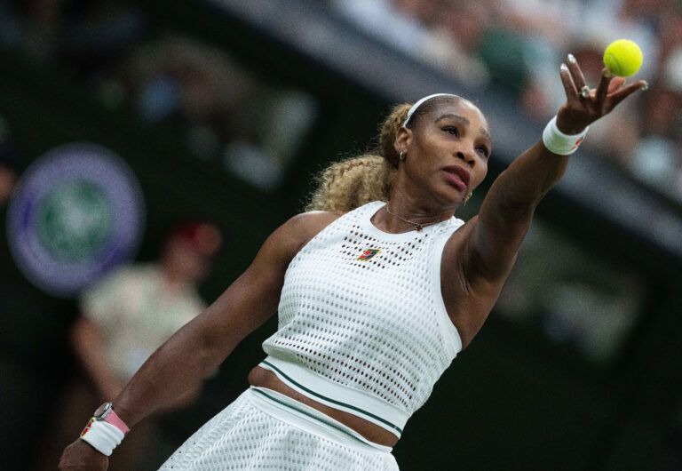 Serena Williams of the United States tosses the ball to serve  during her match against Maya Joint of Australia on day two at All England Lawn Tennis and Croquet Club.