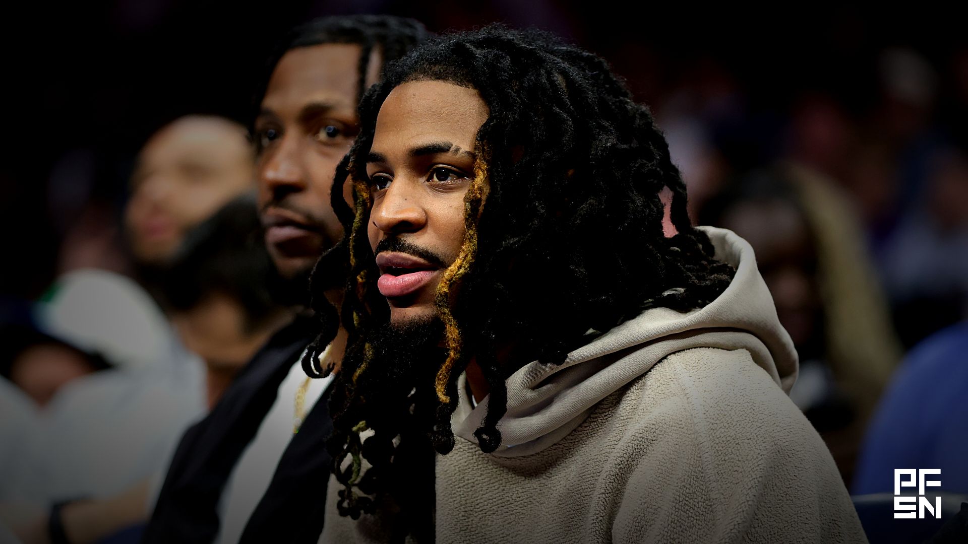 Memphis Grizzlies guard Ja Morant watches from the bench during the second half against the Charlotte Hornets at Spectrum Center.