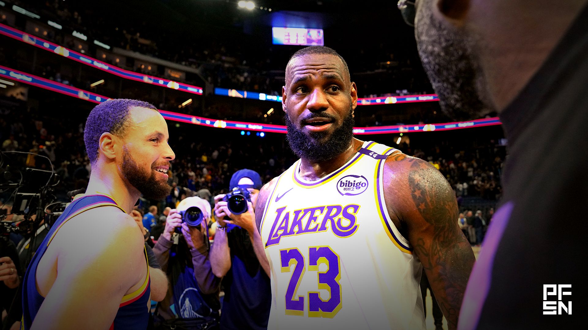 Los Angeles Lakers forward LeBron James (23) talks with Golden State Warriors guard Stephen Curry (left) and forward Draymond Green (right) after the game at Chase Center.