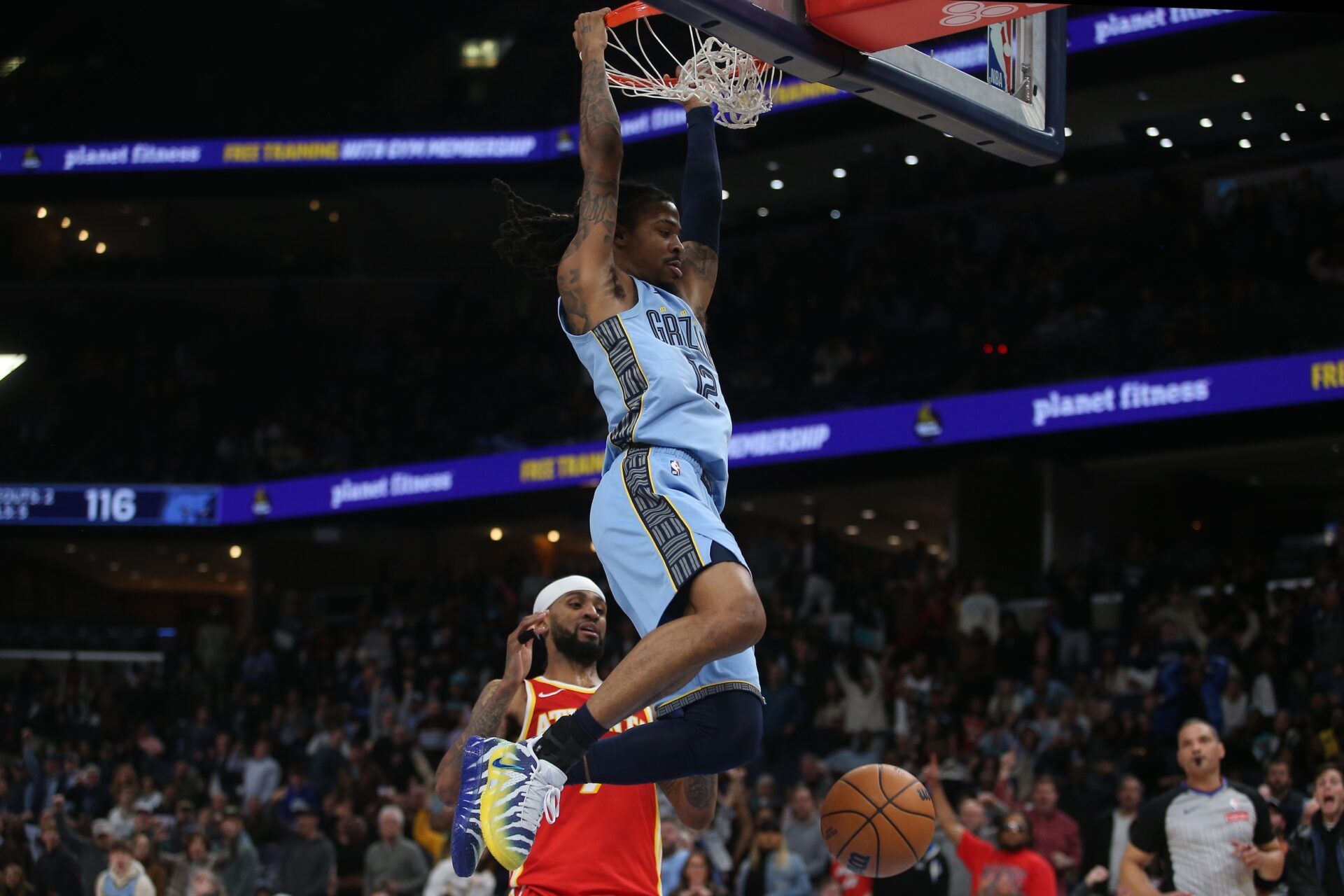 Memphis Grizzlies guard Ja Morant (12) dunks during the fourth quarter against the Atlanta Hawks at FedExForum.