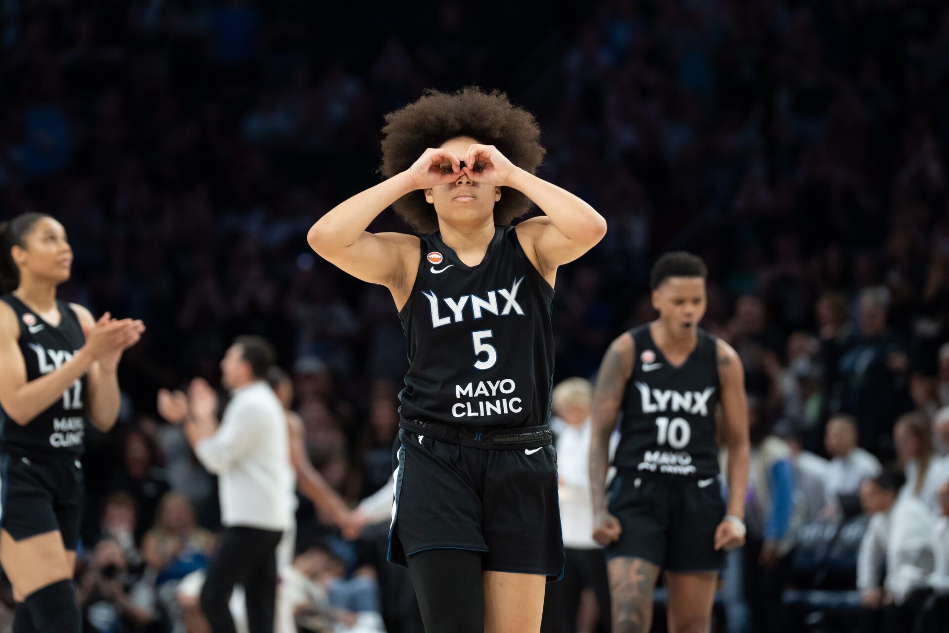 Minnesota Lynx guard Olivia Miles (5) celebrates making a go ahead three point shot against the Phoenix Mercury in the second half at Target Center.