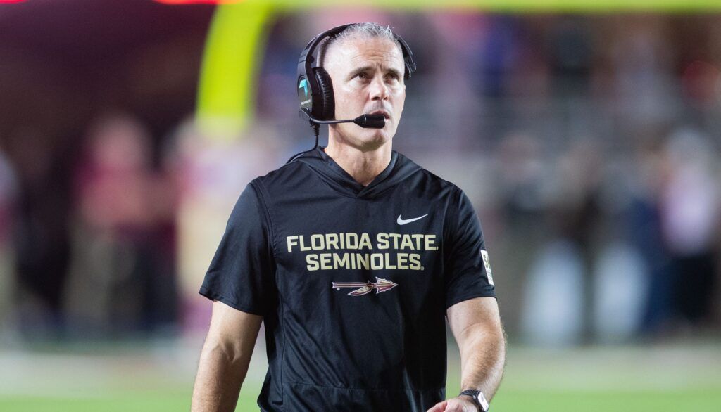 Photo: profootballnetwork.com Florida State Seminoles head coach Mike Norvell walks down the field. The Miami Hurricanes lead the Florida State Seminoles