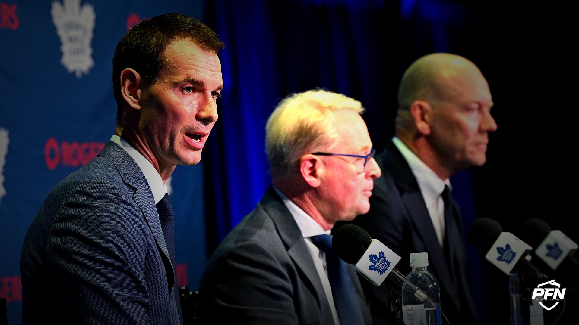 Toronto Maple Leafs general manager John Chayka answers media questions beside Maple Leafs Sports and Entertainment CEO Keith Pelley and senior executive advisor Mats Sundin during an introductory news conference at Real Sports Bar and Grill.