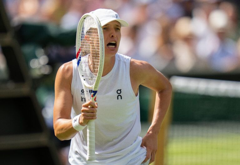 Iga Swiatek of Poland celebrates winning her match against Taylor Townsend of the United States on day two at All England Lawn Tennis and Croquet Club.