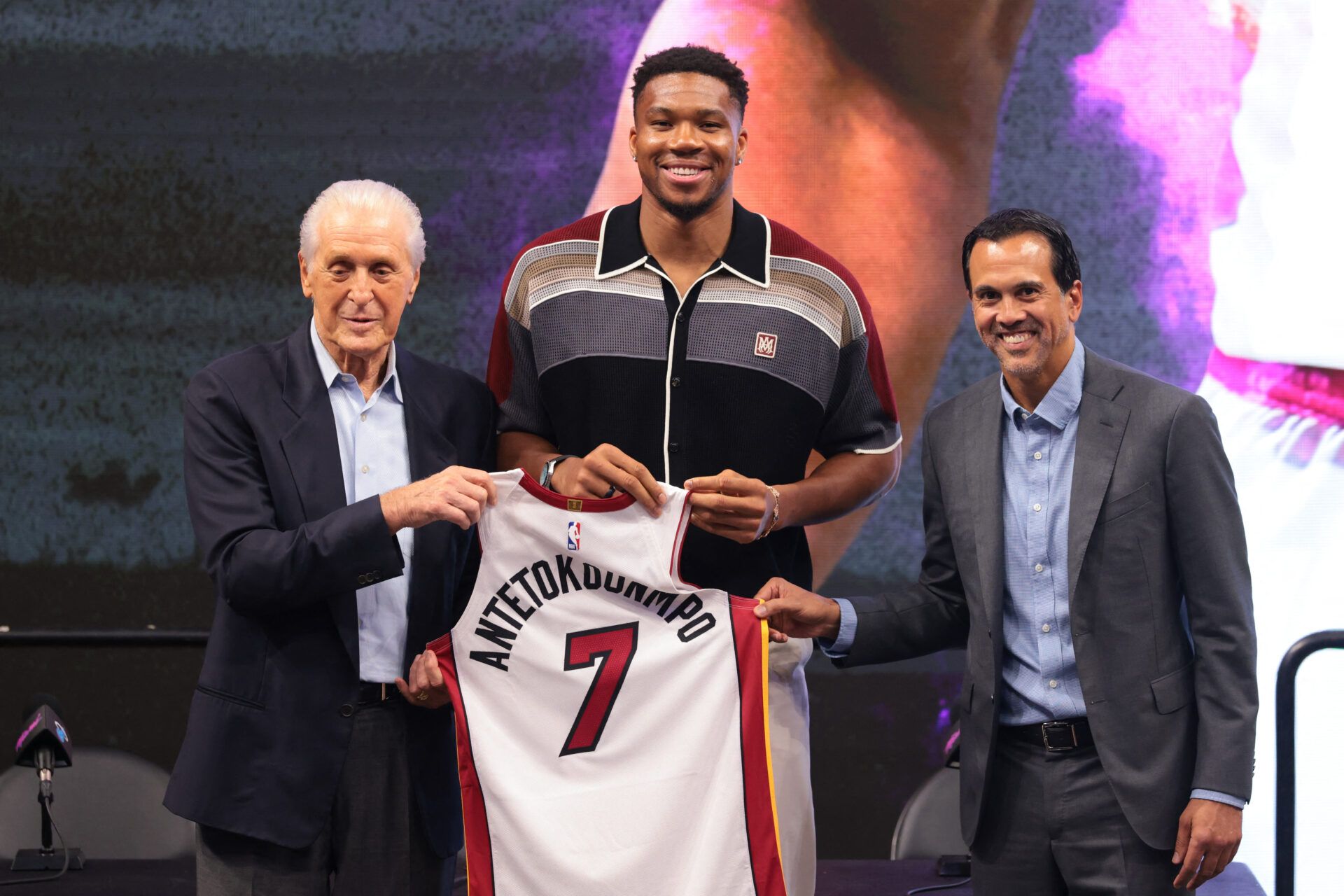 Miami Heat forward Giannis Antetokounmpo (7) is introduced as a new member of the team by Miami Heat president Pat Riley (left) and head coach Erik Spoelstra (right) during a press conference at Kaseya Center.