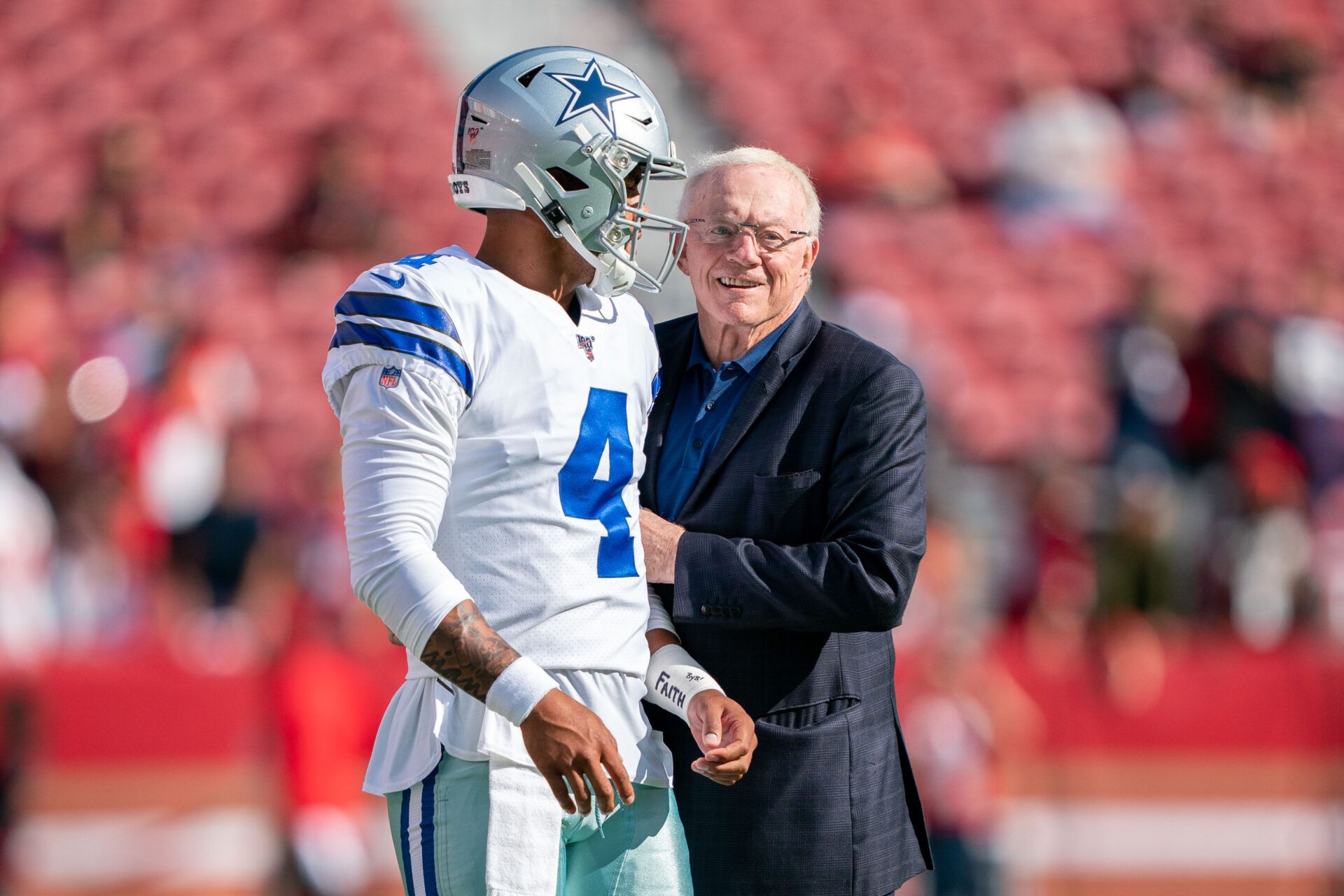 Dallas Cowboys quarterback Dak Prescott (4) and owner Jerry Jones (right) before the game against the San Francisco 49ers at Levi's Stadium.