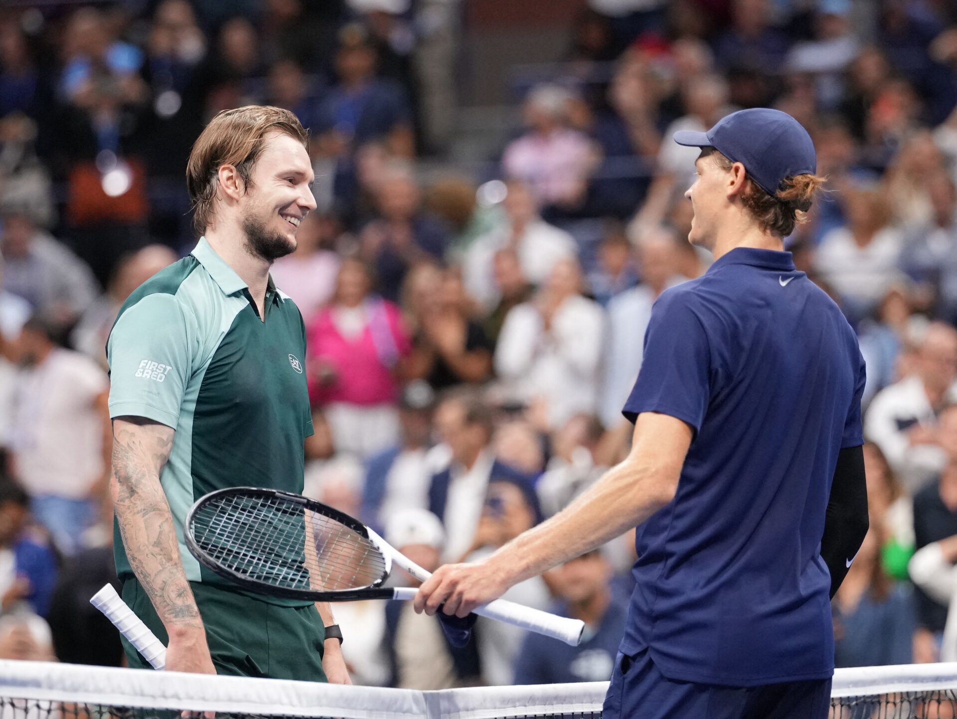 Jannik Sinner (ITA)(right) after beating Alexander Bublik (KAZ) (left) on day nine of the 2025 U.S. Open tennis tournament at the USTA Billie Jean King National Tennis Center.