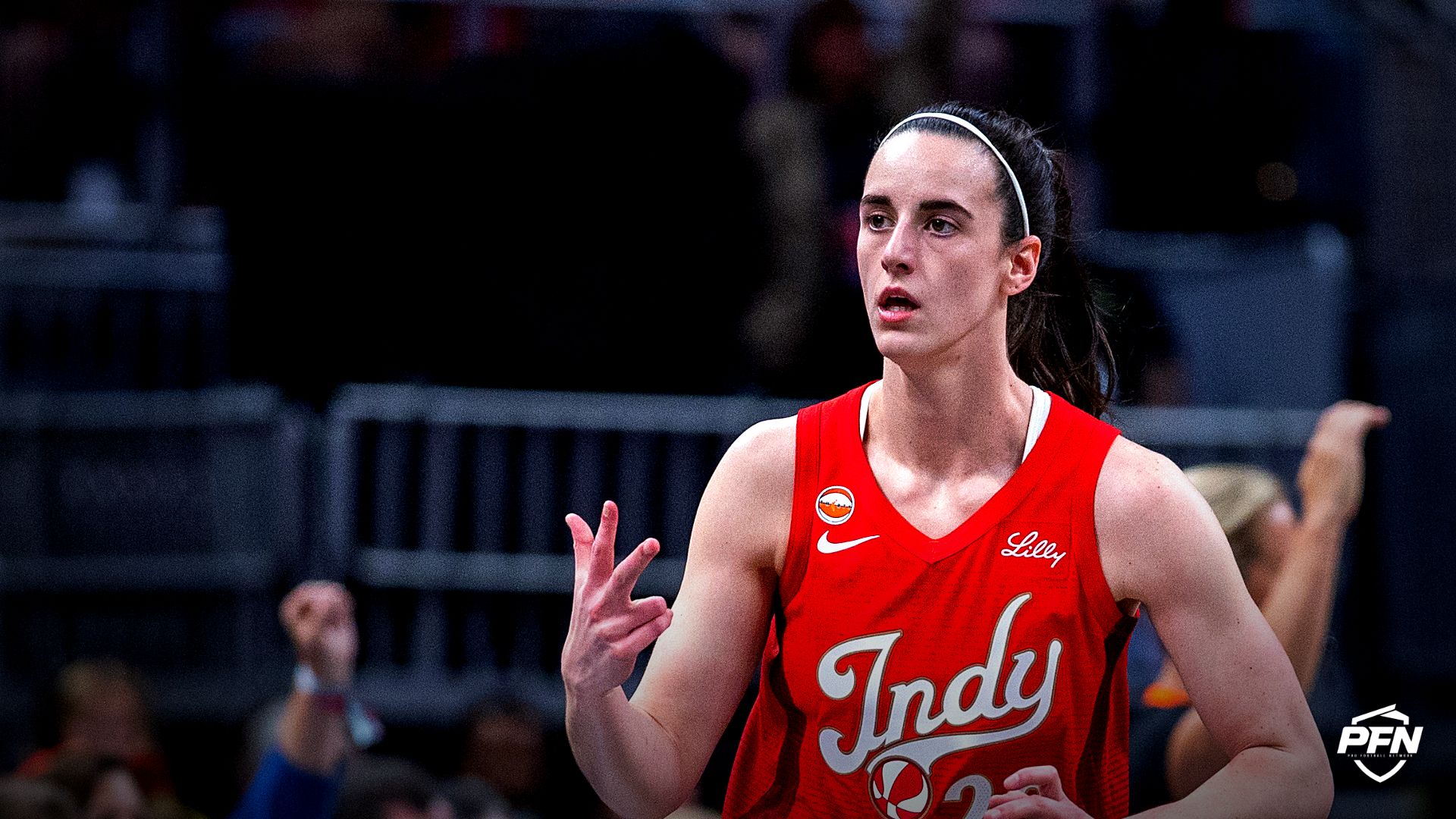 Indiana Fever guard Caitlin Clark (22) gestures after making a three-point shot against the Seattle Storm during the first half at Gainbridge Fieldhouse.
