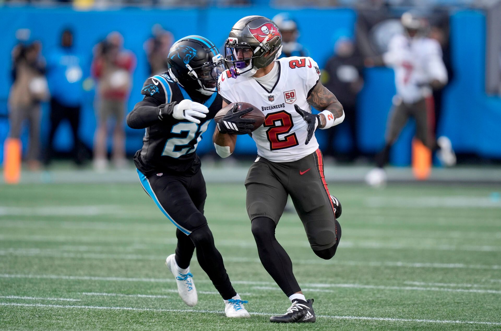 Tampa Bay Buccaneers wide receiver Emeka Egbuka (2) runs against Carolina Panthers safety Nick Scott (21) during the second half at Bank of America Stadium.