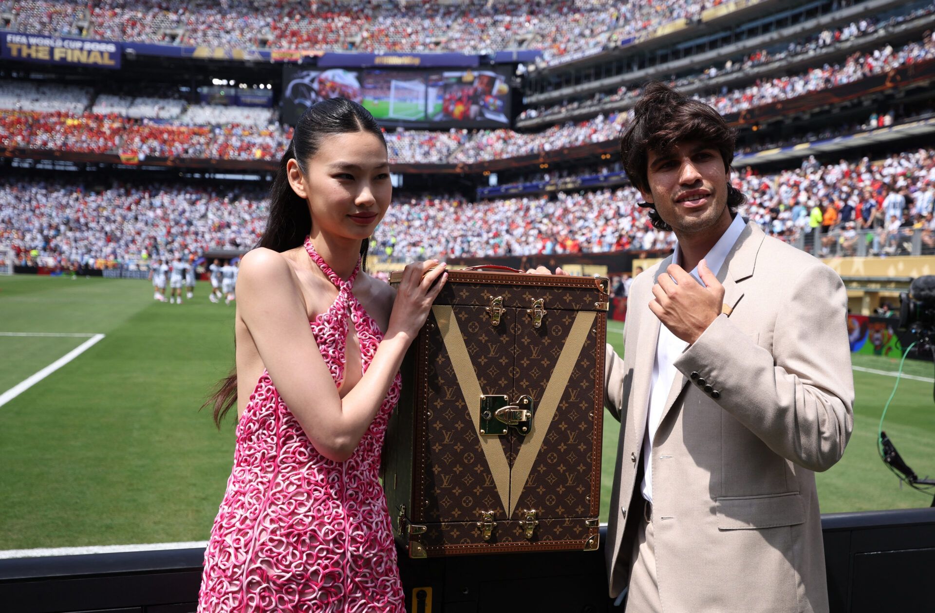 Soccer Football - FIFA World Cup 2026 - Final - Spain v Argentina - New York/New Jersey Stadium, East Rutherford, New Jersey, U.S. - July 19, 2026 Tennis player Carlos Alcaraz and Actress Hoyeon with The Louis Vuitton Trophy Trunk inside the stadium before the match REUTERS/Lee Smith