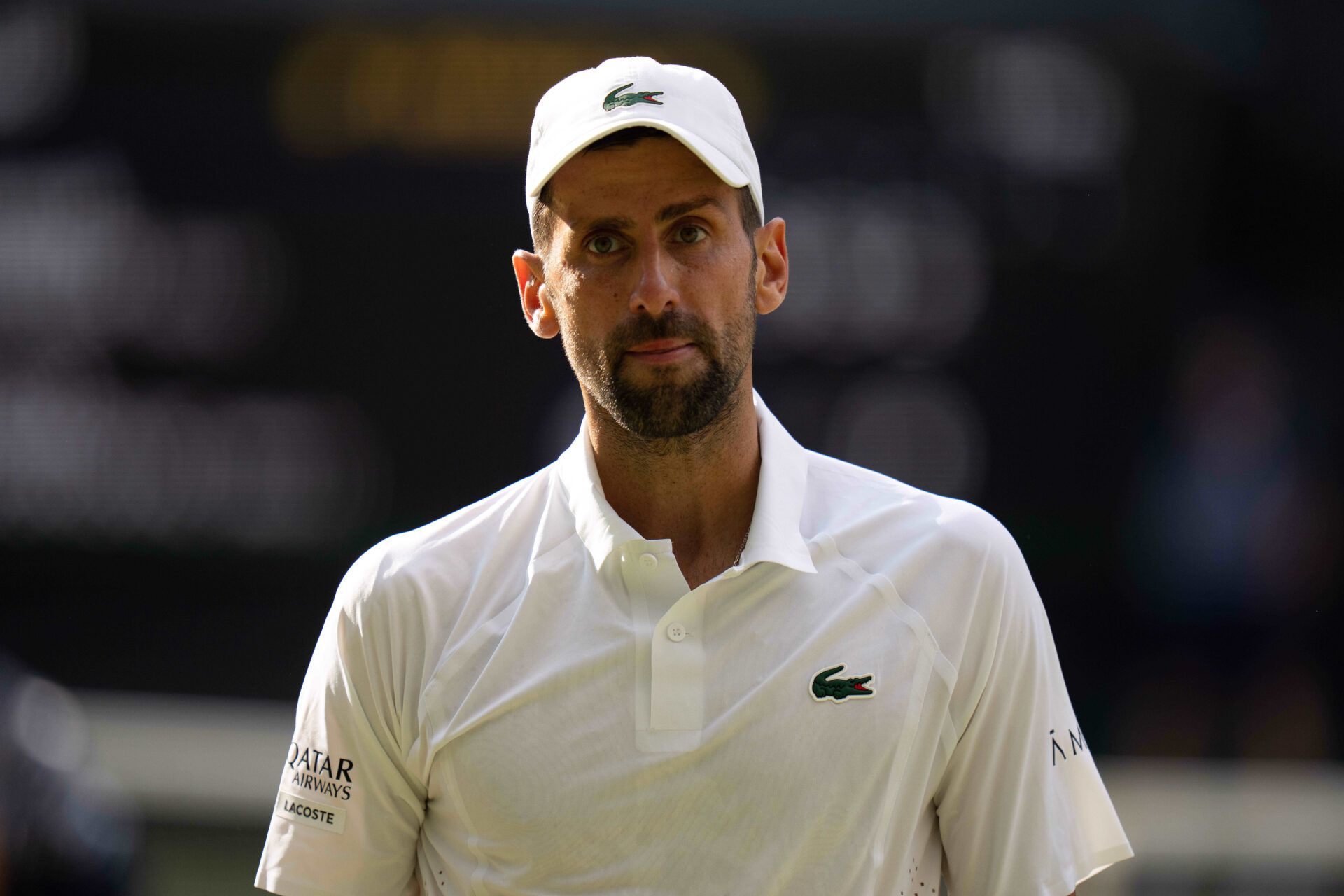 Novak Djokovic of Serbia during his semifinal match against Jannik Sinner of Italy on day 12 at All England Lawn Tennis and Croquet Club.