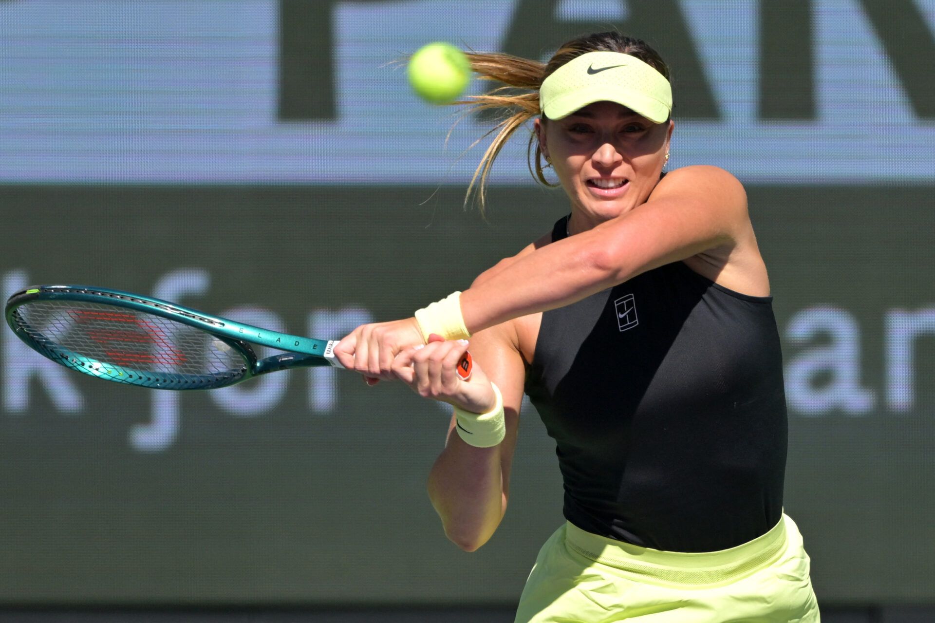 Paula Badosa (ESP) hits a shot against Yulia Putintseva (KAZ) in her first round match during the BNP Paribas Open at the Indian Wells Tennis Garden.