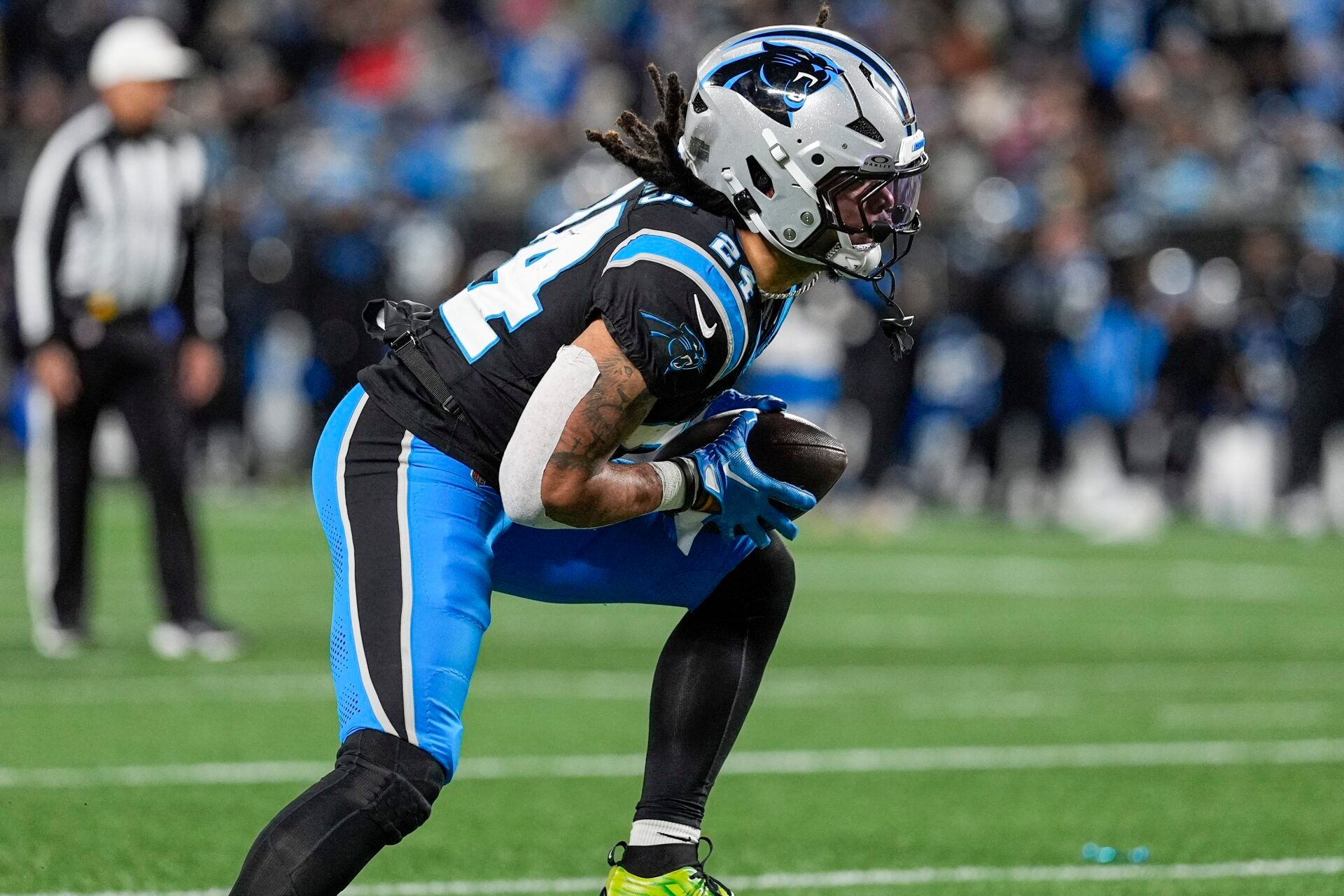 Carolina Panthers running back Jonathon Brooks (24) runs for yardage against the Tampa Bay Buccaneers during the second half at Bank of America Stadium.