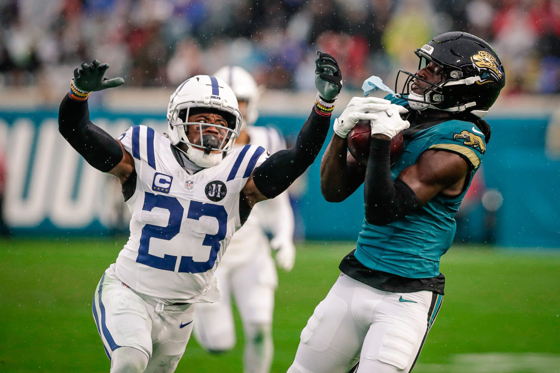 Jacksonville Jaguars wide receiver Brian Thomas Jr. (7) catches a pass over Indianapolis Colts cornerback Kenny Moore II (23) at EverBank Stadium.
