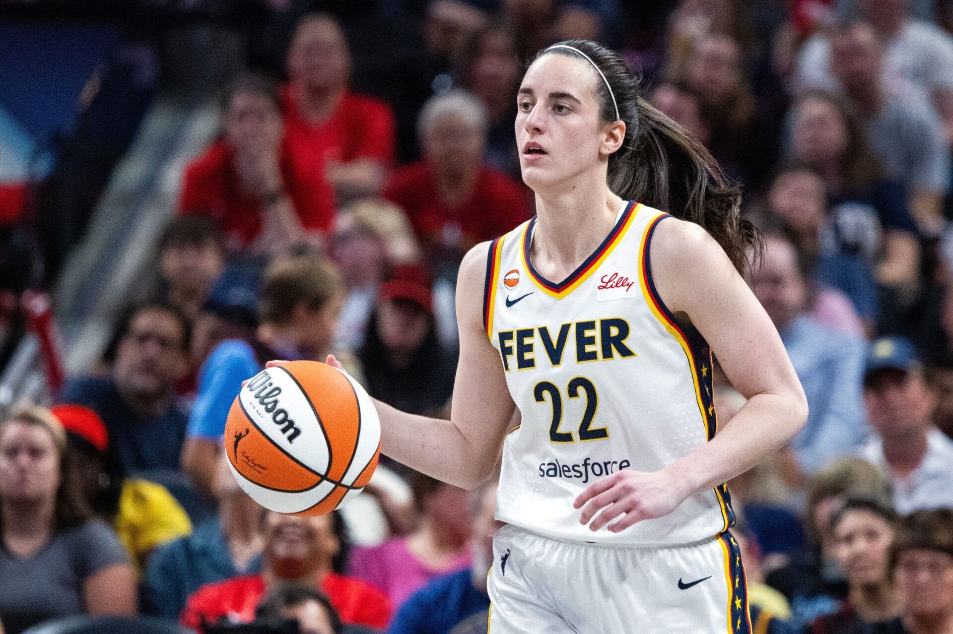 Indiana Fever guard Caitlin Clark (22) dribbles the ball  in the first half against the Connecticut Sun at Gainbridge Fieldhouse.