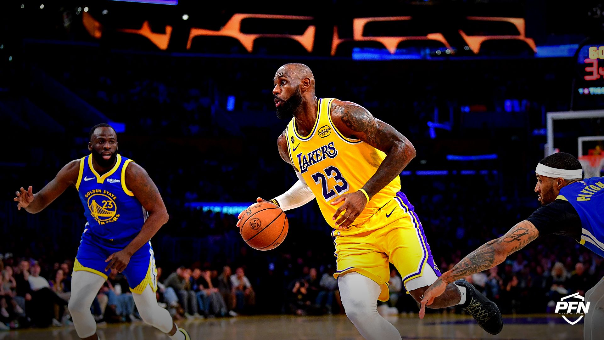 Los Angeles Lakers forward LeBron James (23) moves to the basket against Golden State Warriors guard Gary Payton II (0) and forward Draymond Green (23) during the first half at Crypto.com Arena.