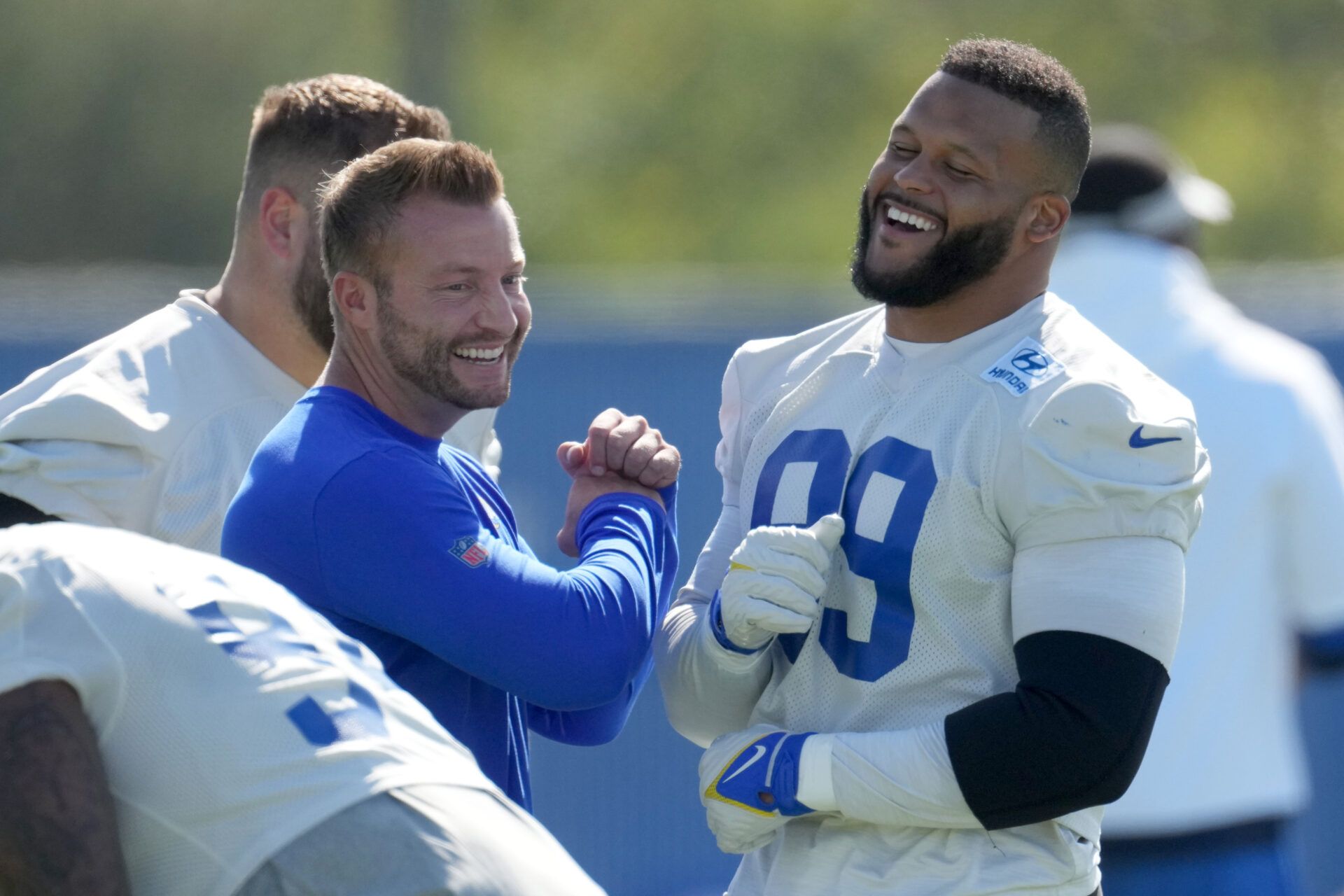 Los Angeles Rams defensive end Aaron Donald (99) and coach Sean McVay react during minicamp at Cal Lutheran University.