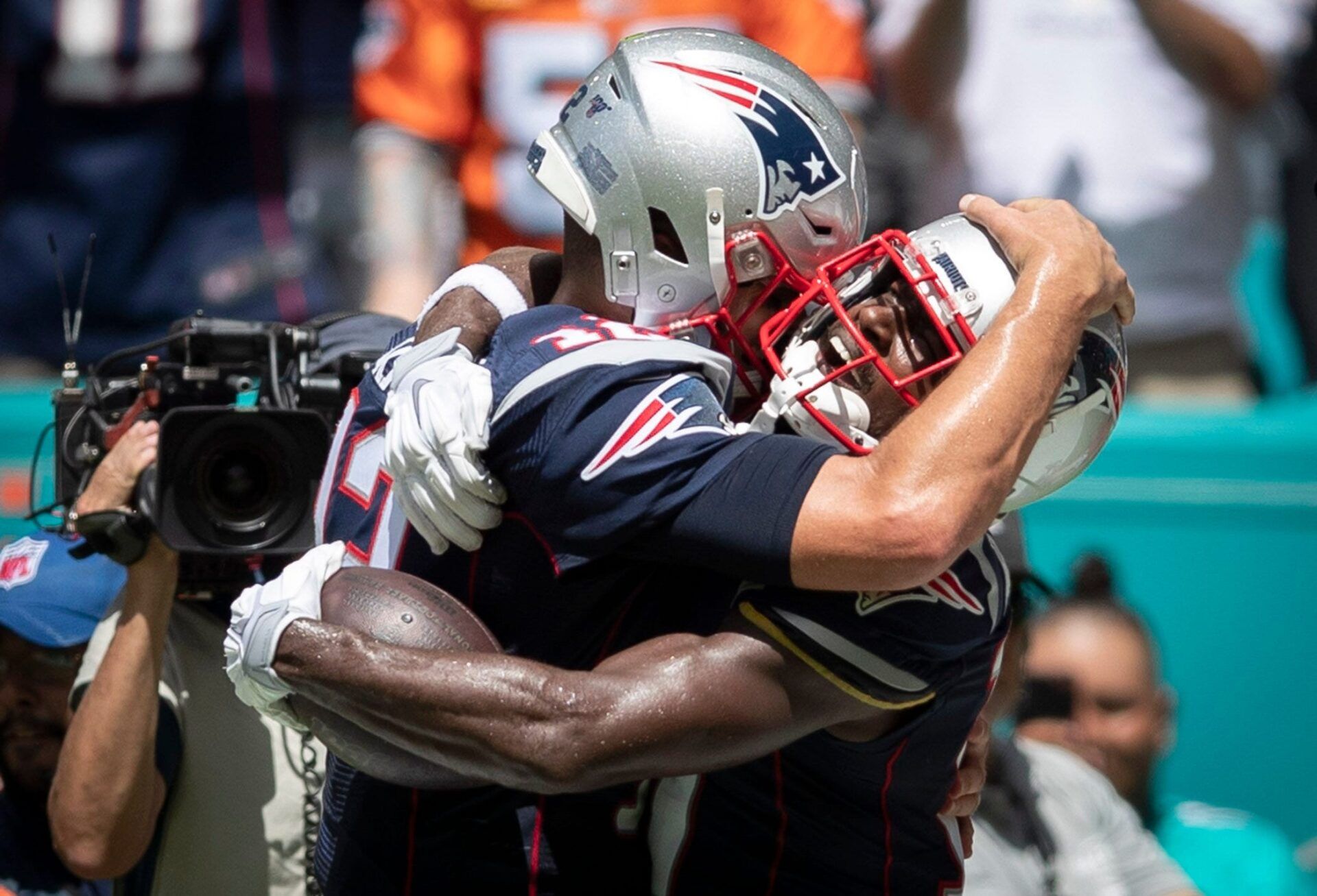 New England Patriots wide receiver Antonio Brown (17) (right) hugs New England Patriots quarterback Tom Brady (12) after catching a touchdown pass in the second quarter in Miami Gardens, September 15, 2019.  [ALLEN EYESTONE/The Palm Beach Post]

Maimi Dolphins Vs New England Patriots