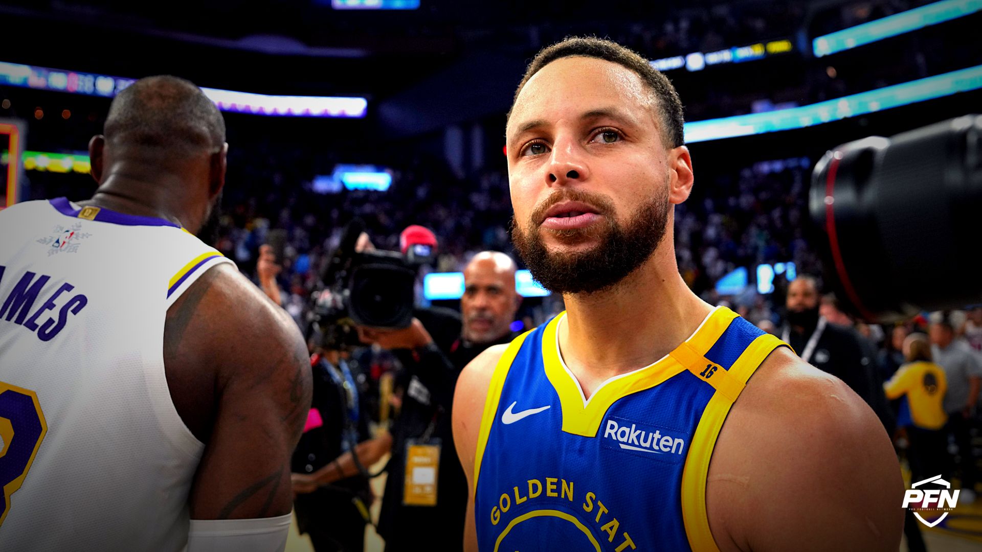 Golden State Warriors guard Stephen Curry (30) stands on the court after greeting Los Angeles Lakers forward LeBron James (left) after the game at Chase Center.