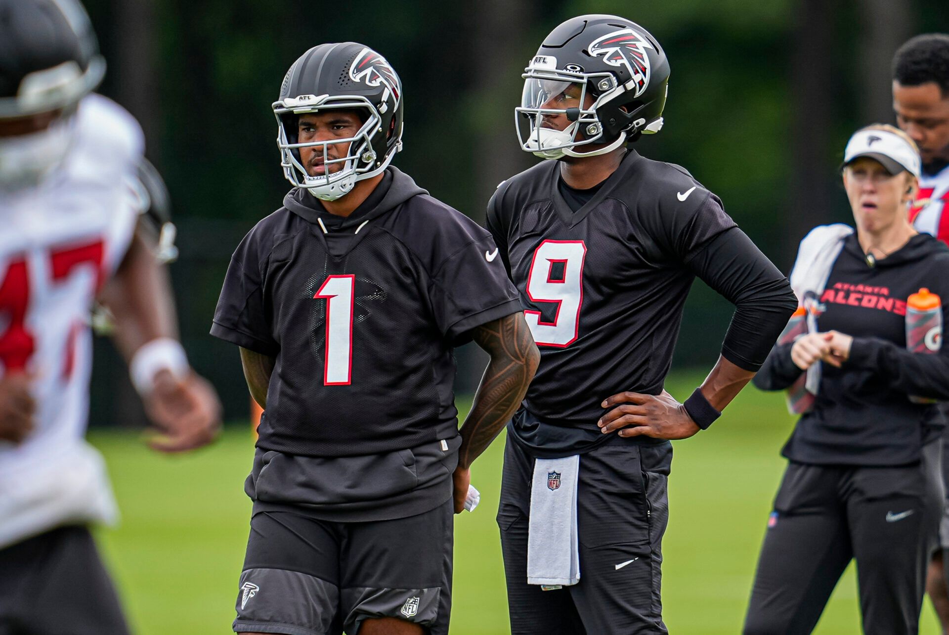 Atlanta Falcons quarterbacks Tua Tagovailoa (1) and  Michael Penix Jr. (9) on the field during Minicamp.