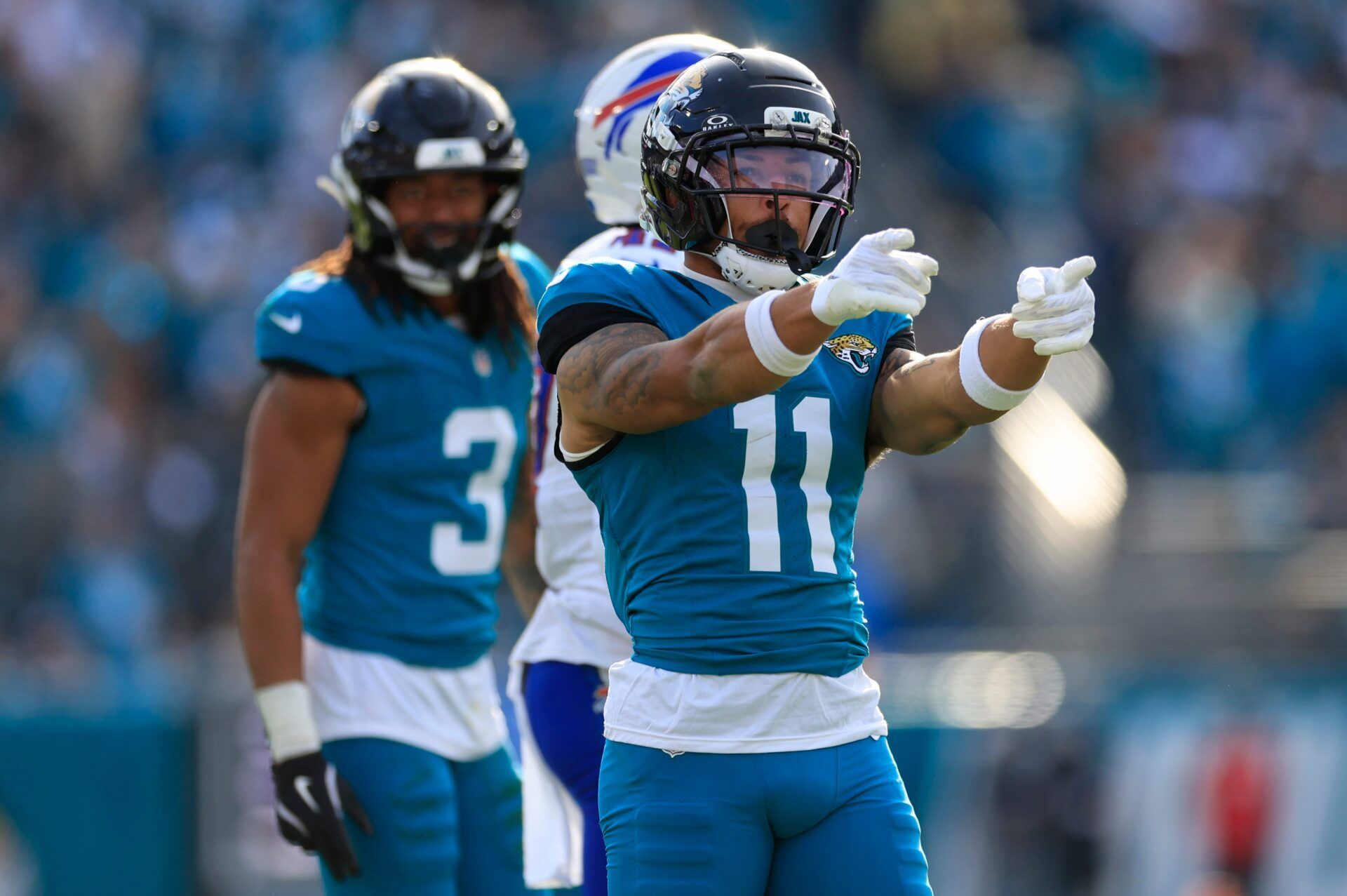 Jacksonville Jaguars wide receiver Parker Washington (11) celebrates his first down pickup during the third quarter of an NFL football AFC Wild Card playoff matchup, Sunday, Jan. 11, 2026, in Jacksonville, Fla. The Bills defeated the Jaguars 27-24. [Corey Perrine/Florida Times-Union]