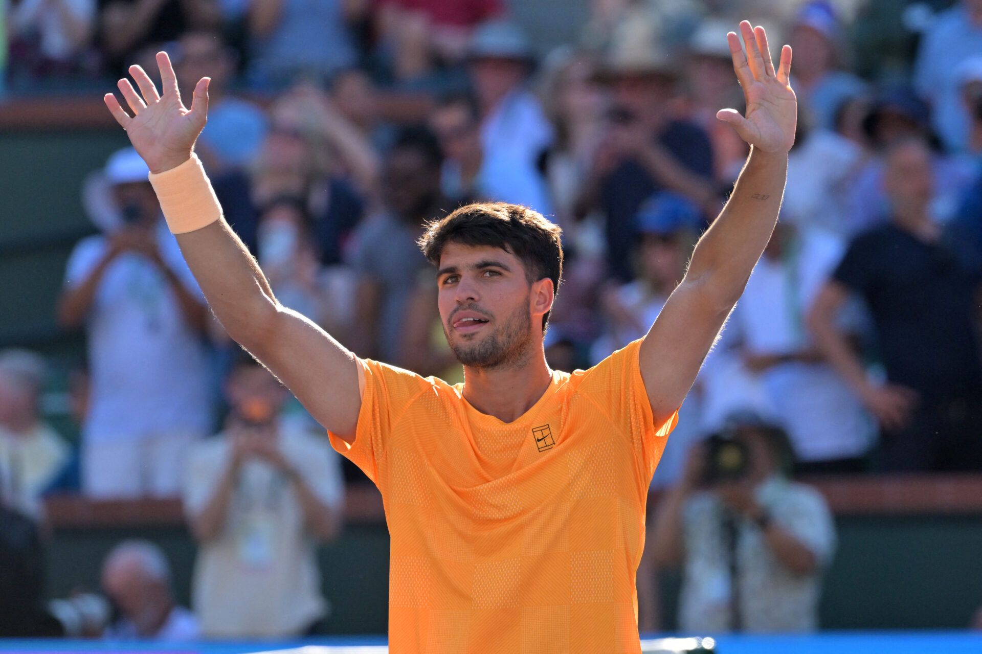 Carlos Alcaraz (ESP) waves to the crowd after he defeated Casper Ruud (NOR) during the fourth round in the BNP Paribas Open at the Indian Wells Tennis Garden.
