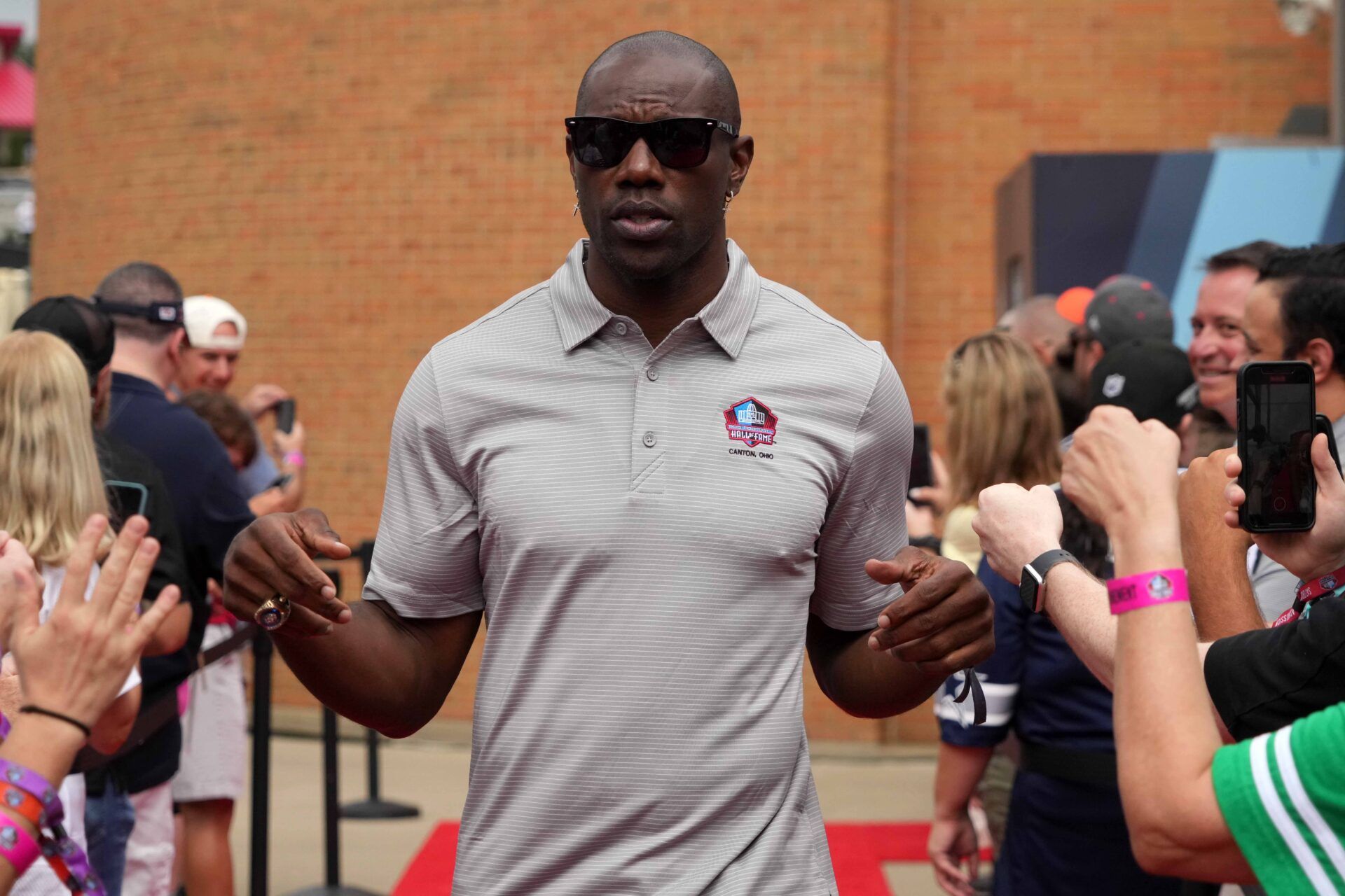 Terrell Owens arrives on the red carpet during the Pro Football Hall of Fame Class of 2022 Enshrinement at Tom Benson Hall of Fame Stadium.