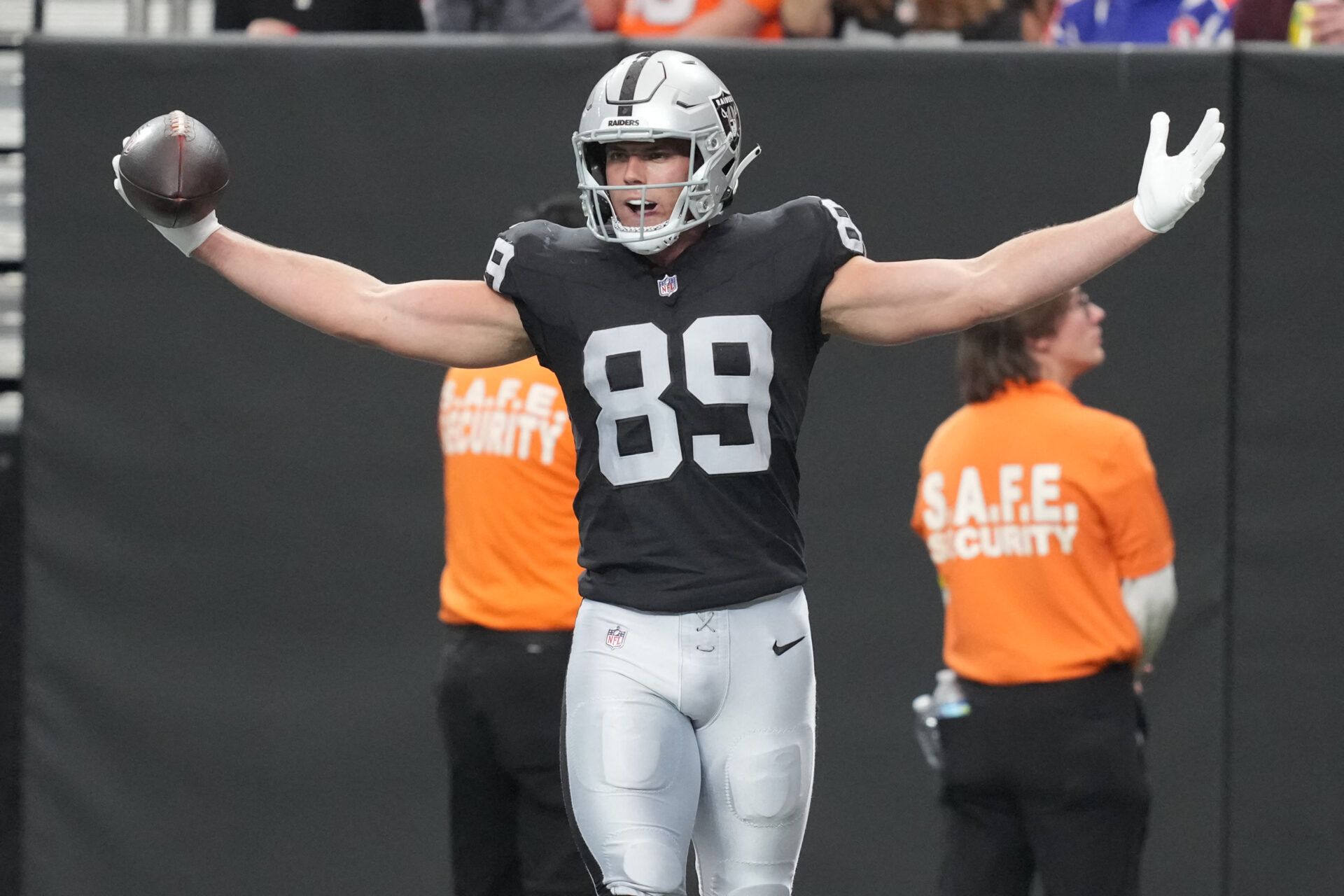 Las Vegas Raiders tight end Brock Bowers (89) reacts after catching a touchdown against the Denver Broncos during the first half at Allegiant Stadium.