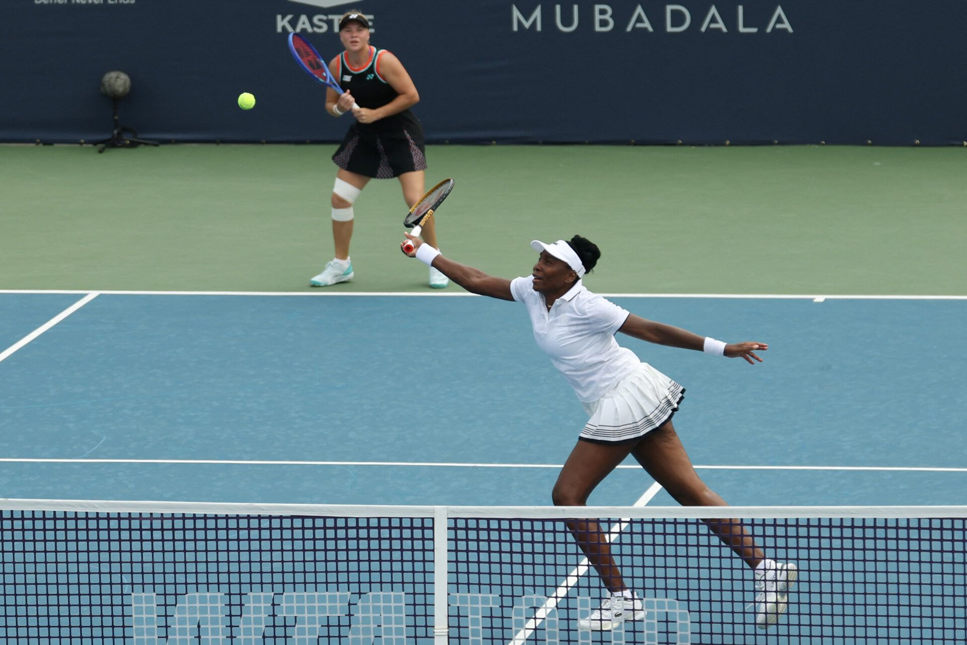 Venus Williams (USA) (R) reaches for a volley in front of partner Diana Shnaider (L) against Quinn Gleason (USA) and Ulrikke Eikeri (NOR) (both not pictured) on day one of the Mubadala DC Open 2026 at Rock Creek Park Tennis Center.