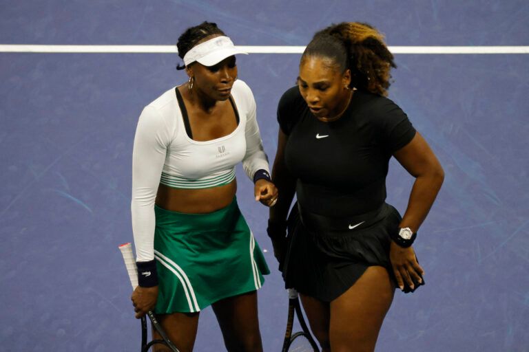 Serena Williams (USA) (R) and Venus Williams (USA) (L) stand on the court against Lucia Hradecka (CZE) and Linda Noskova (CZE) (both not pictured) on day four of the 2022 U.S. Open tennis tournament at USTA Billie Jean King Tennis Center.